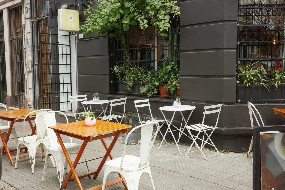 commercial patio umbrellas sunbrella on a coastal restaurant patio with aluminum frames and navy-blue canopies