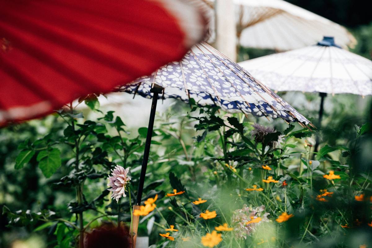 A sturdy umbrella for the garden providing shade over a patio dining set